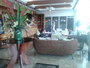 a group of people sitting in a living room at Migs Place at Tagaytay Prime in Tagaytay