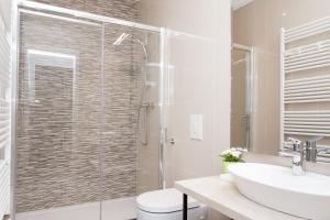 Koupelna v ubytování LOOX apartments Hatzova + 31 fotografií