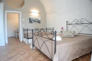 Ένα ή περισσότερα κρεβάτια σε δωμάτιο στο B&B Fontana La Stella