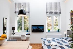 Postel nebo postele na pokoji v ubytování LOOX apartments Hatzova