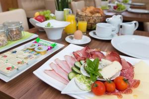 a table with two plates of food on it at Bett&Bike Fisching - adults only in Weißkirchen in Steiermark