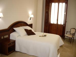 Postel nebo postele na pokoji v ubytování Hotel San Sebastián Hospedería