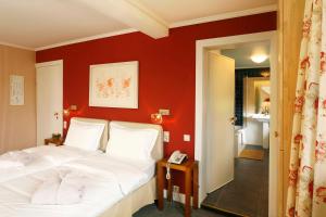 Postel nebo postele na pokoji v ubytování Hotel des Bains & Wellness