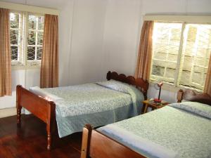 Postel nebo postele na pokoji v ubytování Kiloran House