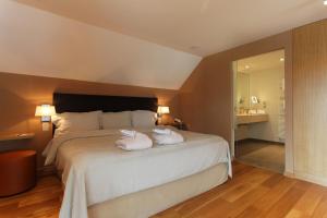 Postel nebo postele na pokoji v ubytování Hotel des Bains & Wellness