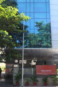 a building with a sign in front of it at The Lotus Apartment hotel, Burkit Road in Chennai