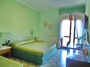 Postel nebo postele na pokoji v ubytování Hotel Giovanna + 37 fotografií