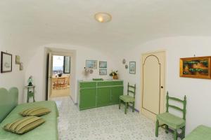 a bedroom with a bed and a desk and chairs at That's Atrani in Atrani