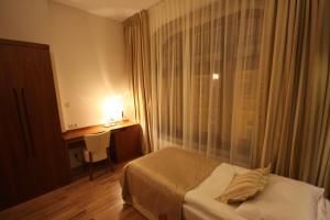 Posteľ alebo postele v izbe v ubytovaní Hotel Vabank