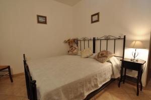 Uma cama ou camas num quarto em I Leoncini