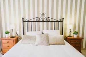 سرير أو أسرّة في غرفة في Vista Paraíso - La Asomada