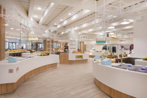 a store interior with white counters and tables at Iberostar Selection Andalucia Playa in Chiclana de la Frontera