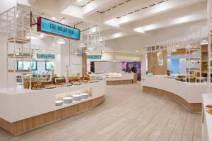 a store interior with counters and a bakery at Iberostar Selection Andalucia Playa in Chiclana de la Frontera