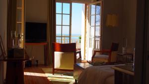 a bedroom with a bed and a view of the ocean at Villa La Tosca in Lanton