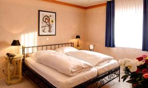 Postel nebo postele na pokoji v ubytování Hotel La Scala