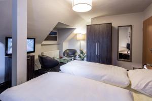 Ein Bett oder Betten in einem Zimmer der Unterkunft Hotel La Scala
