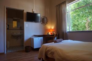 Postel nebo postele na pokoji v ubytování Omaruru Guesthouse
