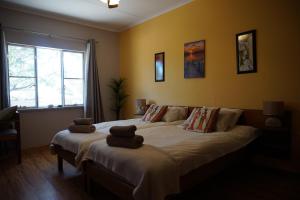 Postel nebo postele na pokoji v ubytování Omaruru Guesthouse