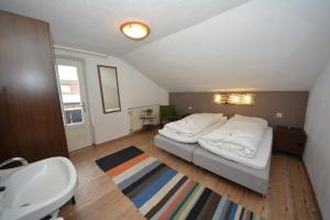 Llit o llits en una habitació de Haus Irmgard by Châtel Reizen