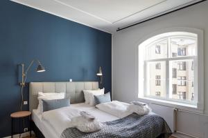 Postel nebo postele na pokoji v ubytování Copenhagen Strand