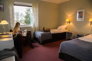 Postel nebo postele na pokoji v ubytování Dinners Mellerud + 22 fotografií