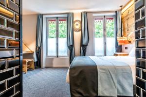 Katil atau katil-katil dalam bilik di Hotel Restaurant Au Boeuf Couronné
