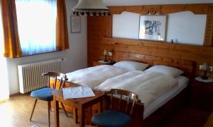 En eller flere senge i et værelse på Landhaus Dora