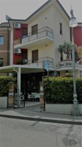 a building with a street light in front of it at Hotel Sirio in Rotonda