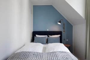 Postel nebo postele na pokoji v ubytování Copenhagen Strand