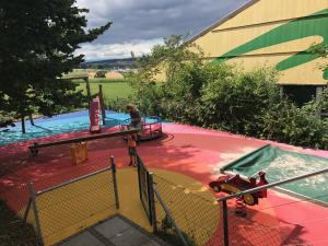 a child on a ride in a water park at Auberge du Guintzet in Fribourg