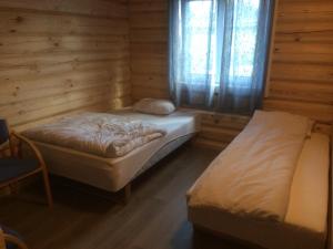 Кровать или кровати в номере Grana Bryggeri