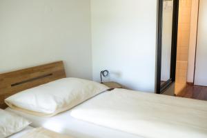 
a bedroom with a bed and a dresser at FT Hotel & Restaurant in Freiburg im Breisgau
