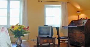 TV a/nebo společenská místnost v ubytování Haus am Kiel