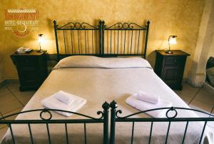 Postel nebo postele na pokoji v ubytování Hotel Risorgimento