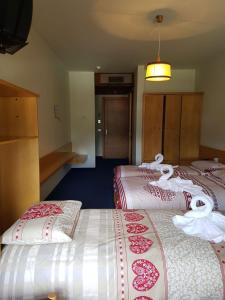 Postel nebo postele na pokoji v ubytování Albergo Posta