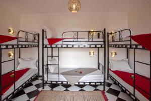 Postel nebo postele na pokoji v ubytování Hostel Amour d'auberge