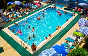 an overhead view of a swimming pool with people in it at Grand Horizon Apart Hotel in Alanya