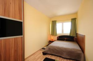 Postel nebo postele na pokoji v ubytování Alpe-Adria Apartments