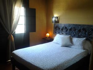 A bed or beds in a room at Casa Maza