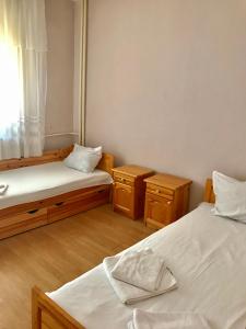 a room with two beds and two night stands at Hostel 29 in Sofia