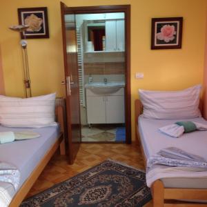Postel nebo postele na pokoji v ubytování Guest House Rose