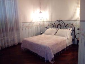 Un pat sau paturi într-o cameră la B&B Il Giovine
