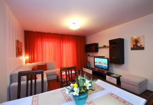 TV a/nebo společenská místnost v ubytování Alpe-Adria Apartments