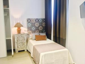 Postel nebo postele na pokoji v ubytování Hostal Alisol Boutique San Pedro