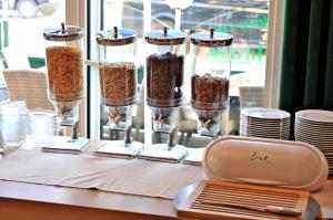 a table with several containers of food and a food scale at Hotel Restaurant Bürgerklause Tapken in Garrel