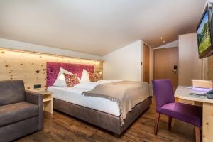 Rúm í herbergi á Hotel Talblick