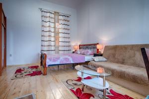 a living room with a couch and a table at Apartments Nikola Vidović in Komiža