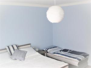 Voodi või voodid majutusasutuse apartman pro 4 osoby toas