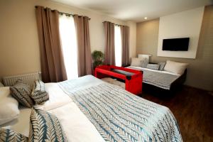 En eller flere senge i et værelse på Apartmán Livingstone - Roudna