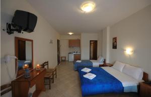 A bed or beds in a room at Panorama Spa Hotel